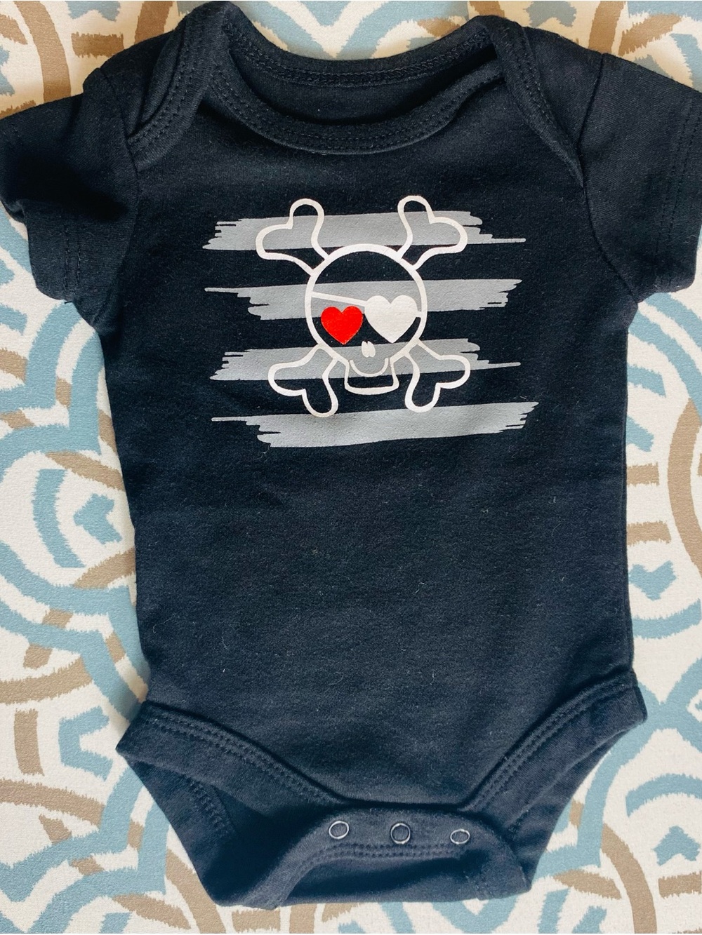 Black Baby One-Piece Bodysuit with Heart-Eye Skull Graphic